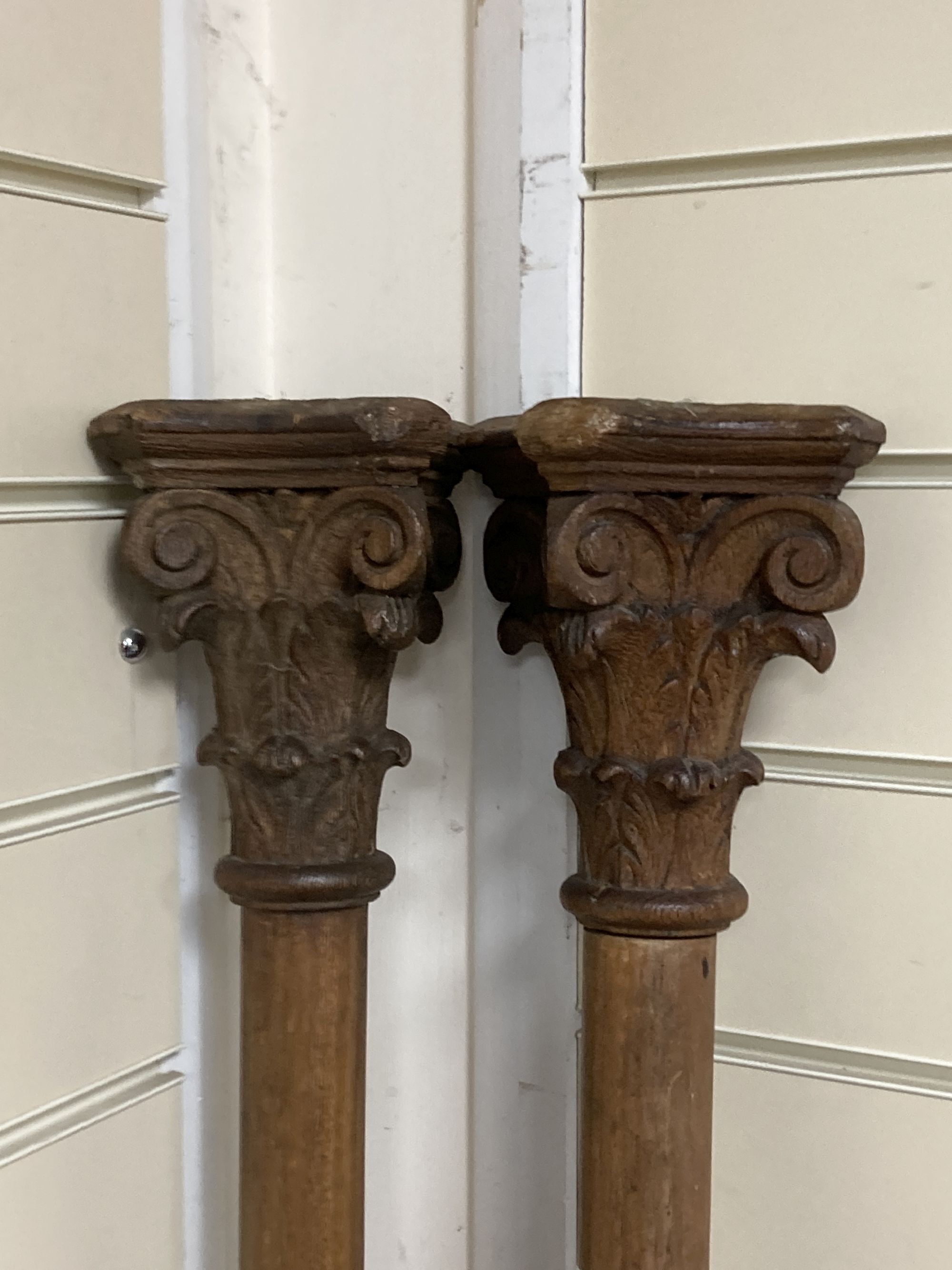 A pair of carved corinthian columns, height 187cm